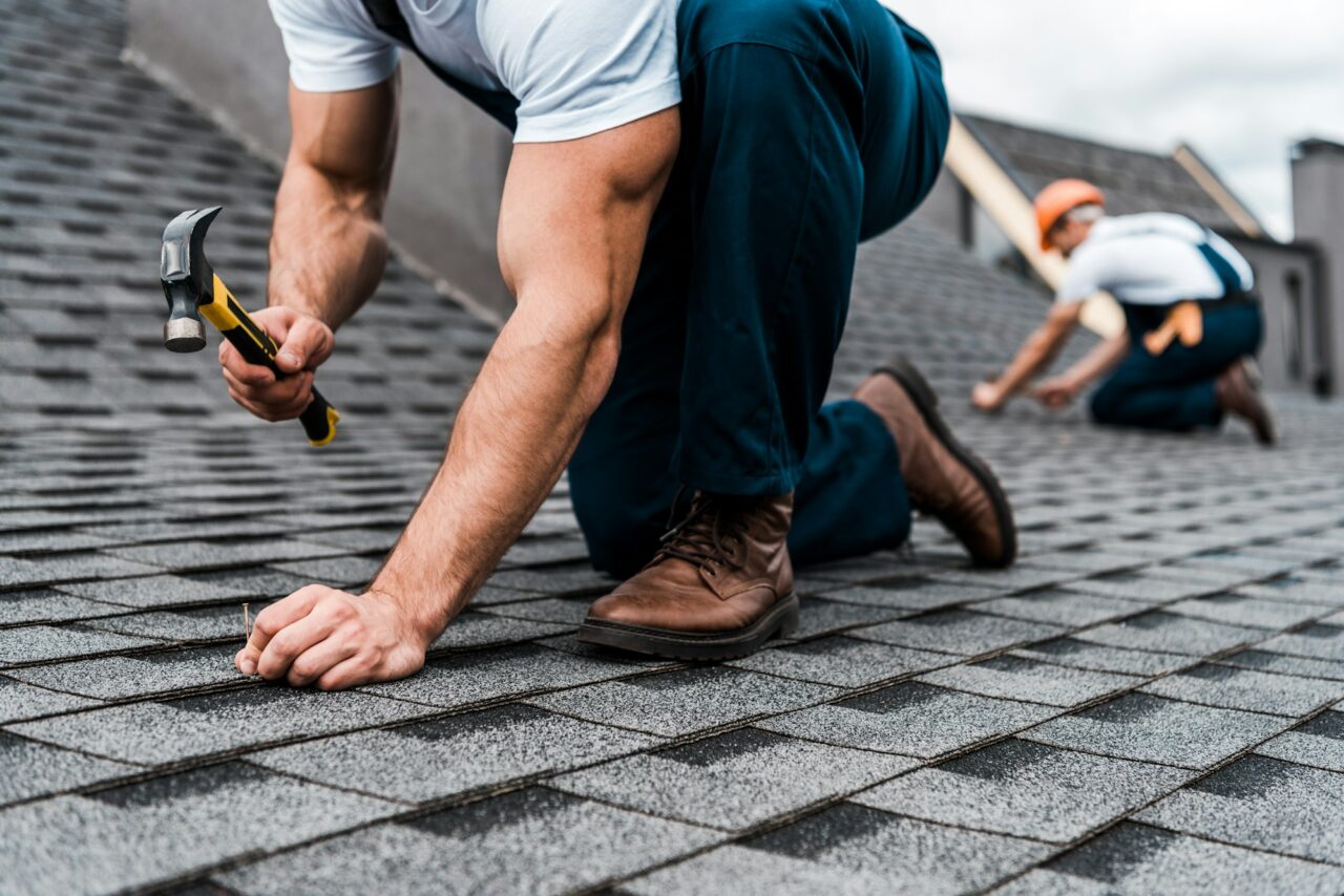 cropped-view-of-repairmen-in-uniform-working-on-rooftop.jpg