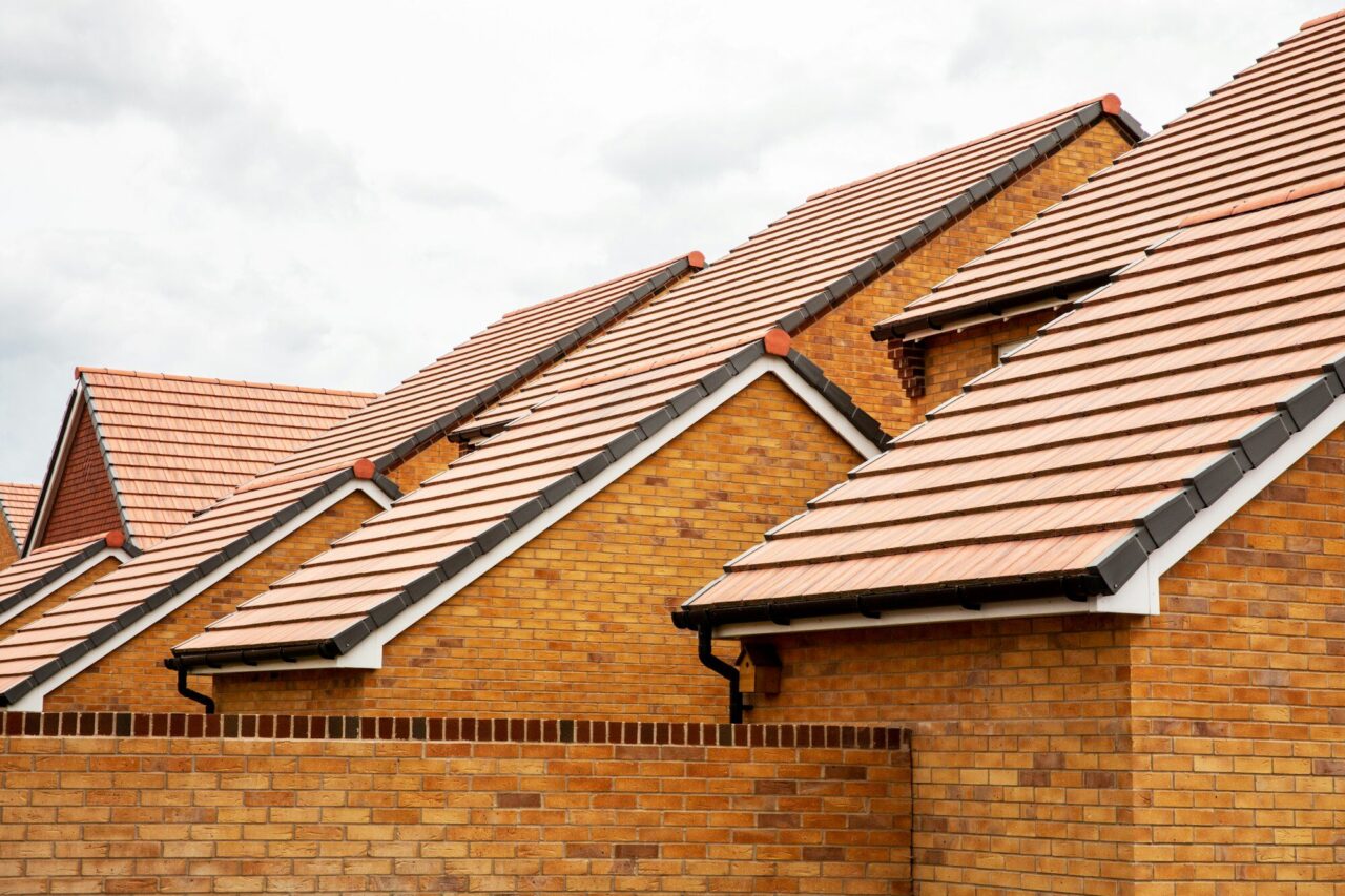exterior-view-of-yellow-brick-row-house-with-yellow-roof-tiles--e1726236523828.jpg